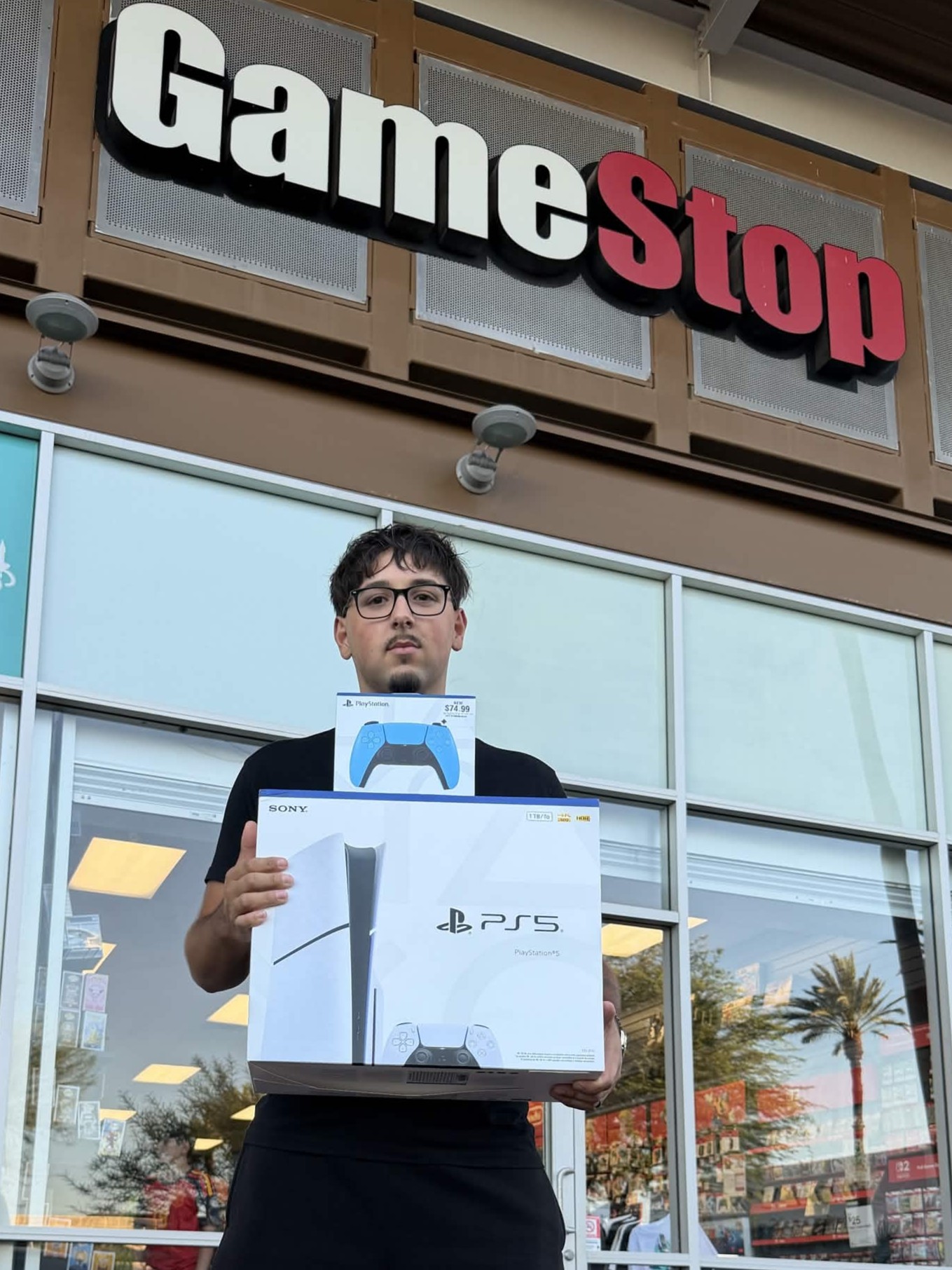 The PlayStation 5 console and DualSense controller grand prize, picked up at GameStop